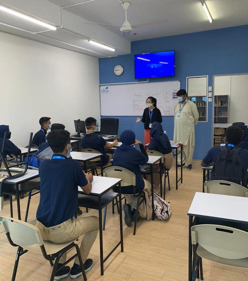 Teacher conducting a lesson following the IGCSE syllabus on Google Classroom for students across three platforms: Combined Physical and Online Homeschooling, Online Homeschooling, and Online Self-Study.